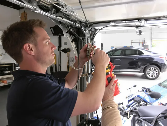 Lake Forest Garage Door Repair safety certified technician performing cable replacement in Lake Forest